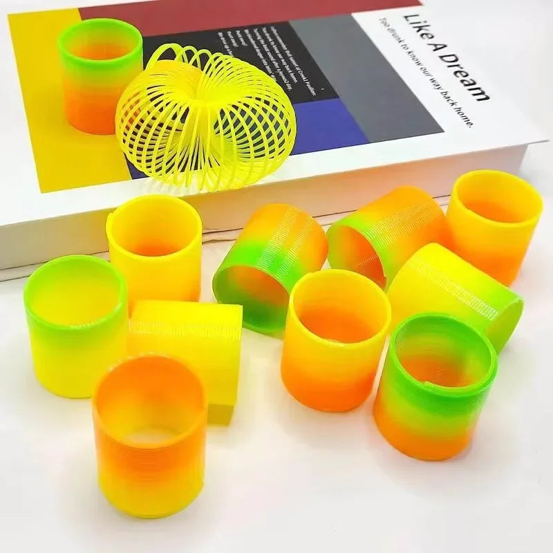 12/24pcs Rainbow Magic Springs Circle Toys Gradient Color Fingertip Coils Funny Kid Toy Halloween Party Favors Christmas Gift